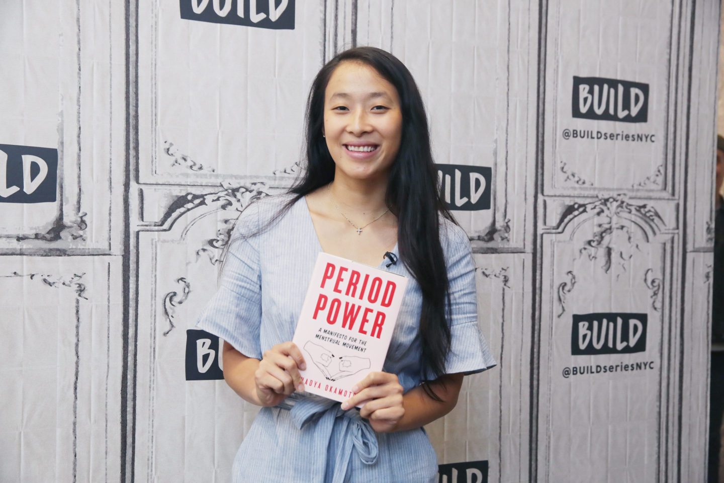 Nadya Okamoto holding her book "Period Power."