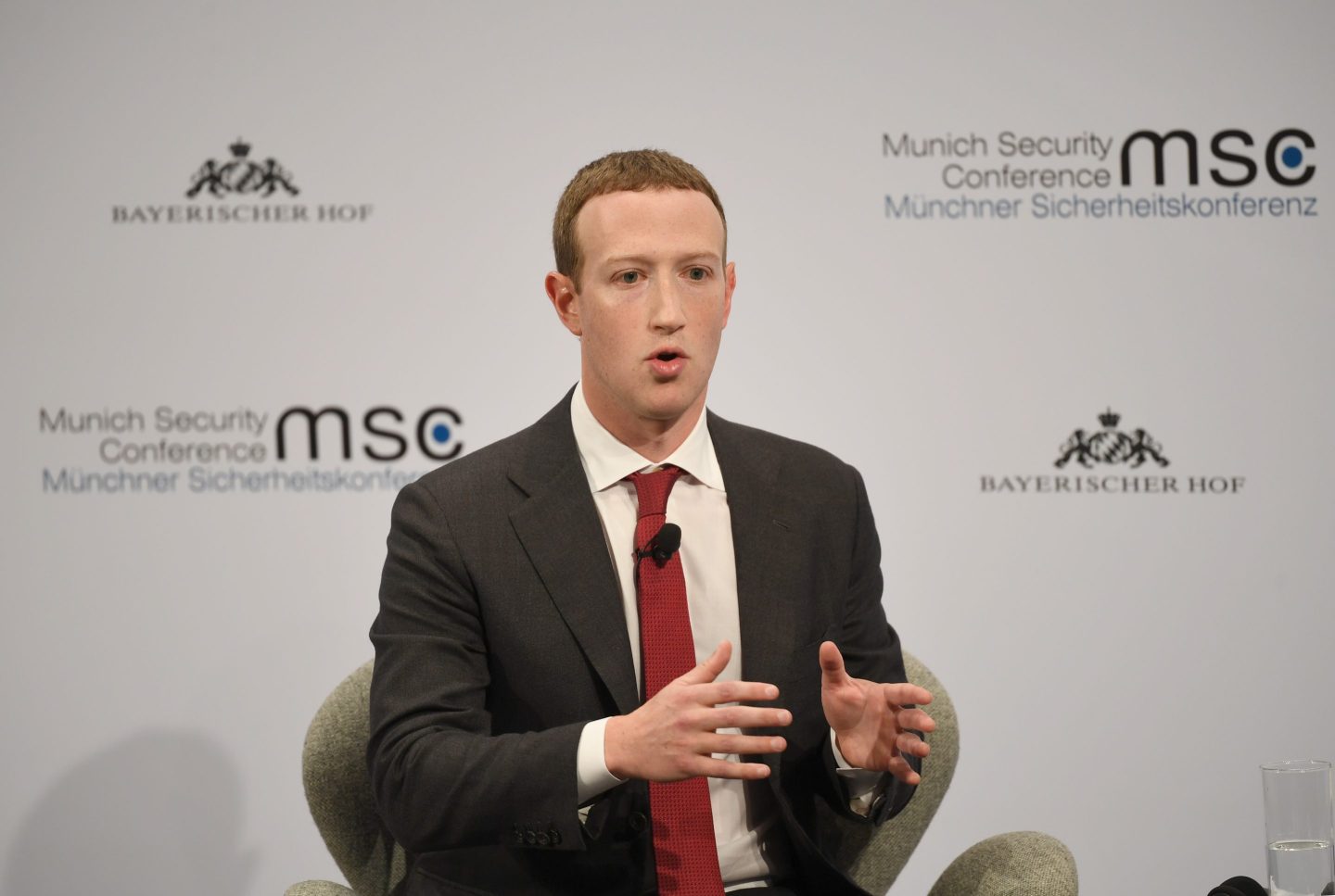 Meta CEO Mark Zuckerberg speaking on stage during an event in Munich.
