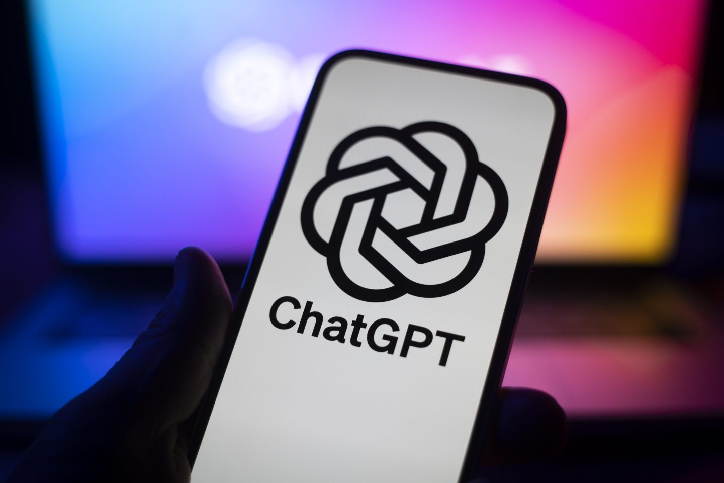 Phone screen with the ChatGPT logo.