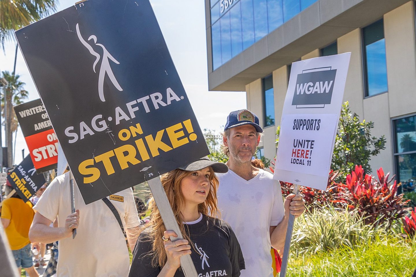 Members of SAG-AFTRA and WGA go on strike at Netflix, Sunset Gower and Paramount Studios