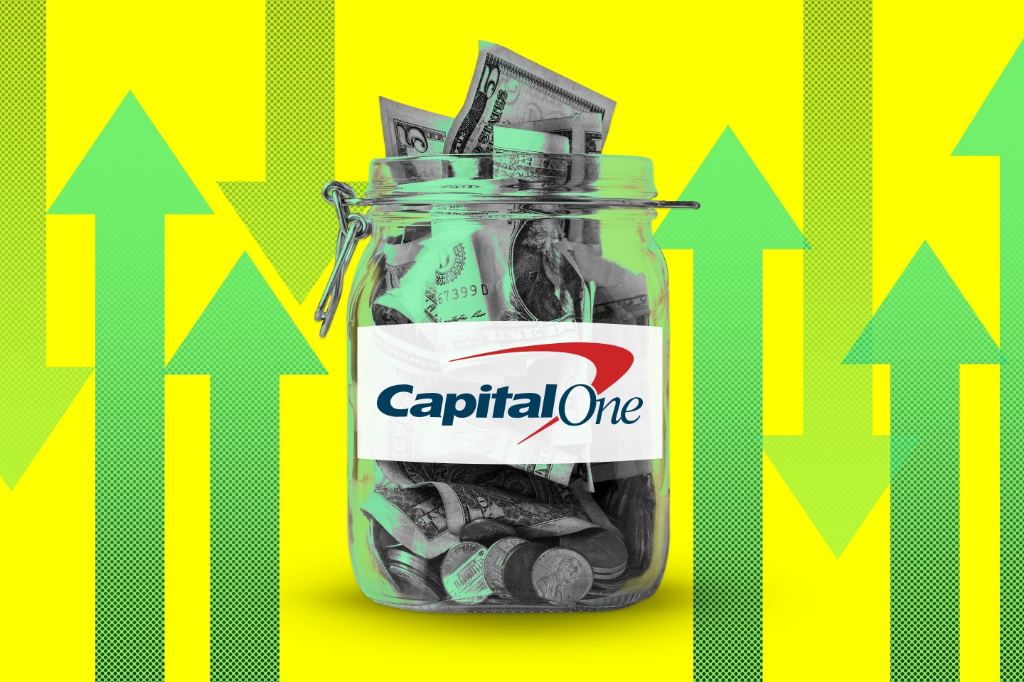 Photo illustration of a glass jar full or money that has the Capital One logo on the front, surrounded by arrows pointing up and down.